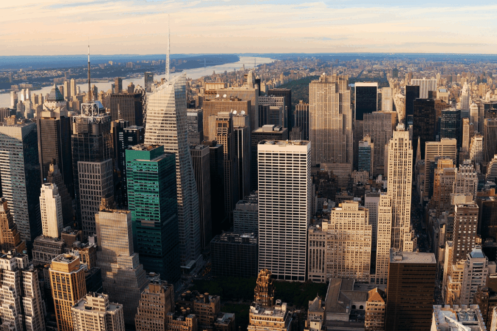 Aerial view of Manhattan showcasing tall buildings and blue skies.