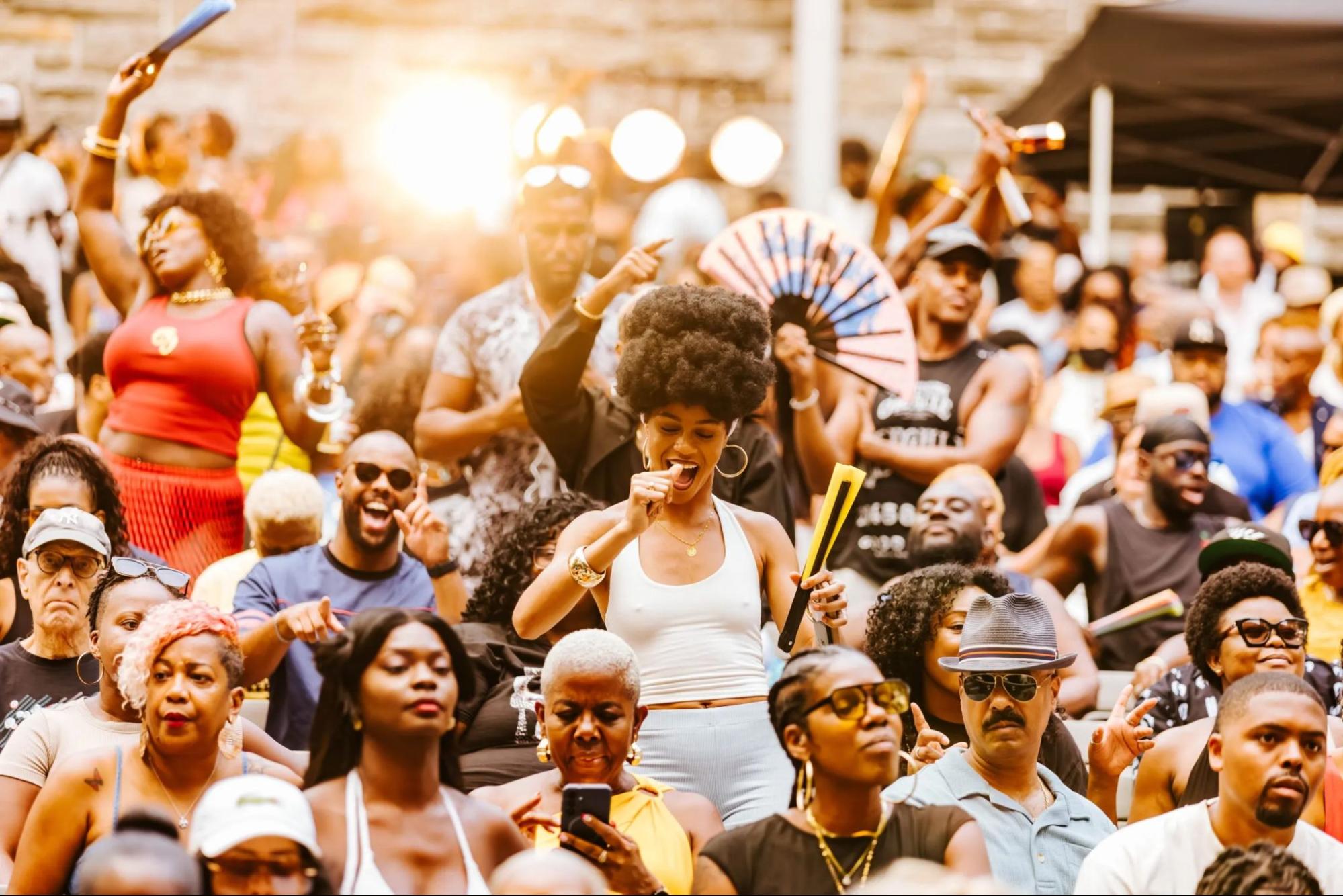 A crowd of people watching an event and dancing. Source: SummerStage/City Parks Foundation